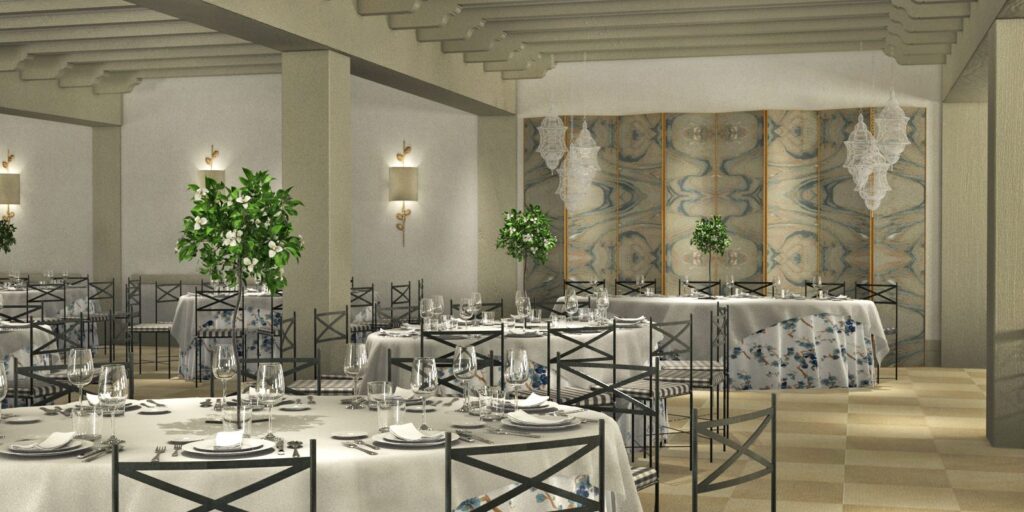 Salón de banquetes con mesas redondas, sillas Crossback y decoración elegante en La Quinta de Illescas.